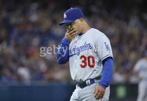 TORONTO, CANADA - MAY 6: Manager Dave Roberts #30 of the Los Angeles Dodgers returns to the dugout after making a trip to the mound in the seventh inning during MLB game action against the Toronto Blue Jays on May 6, 2016 at Rogers Centre in Toronto, Ontario, Canada. (Photo by Tom Szczerbowski/Getty Images) *** Local Caption *** Dave Roberts